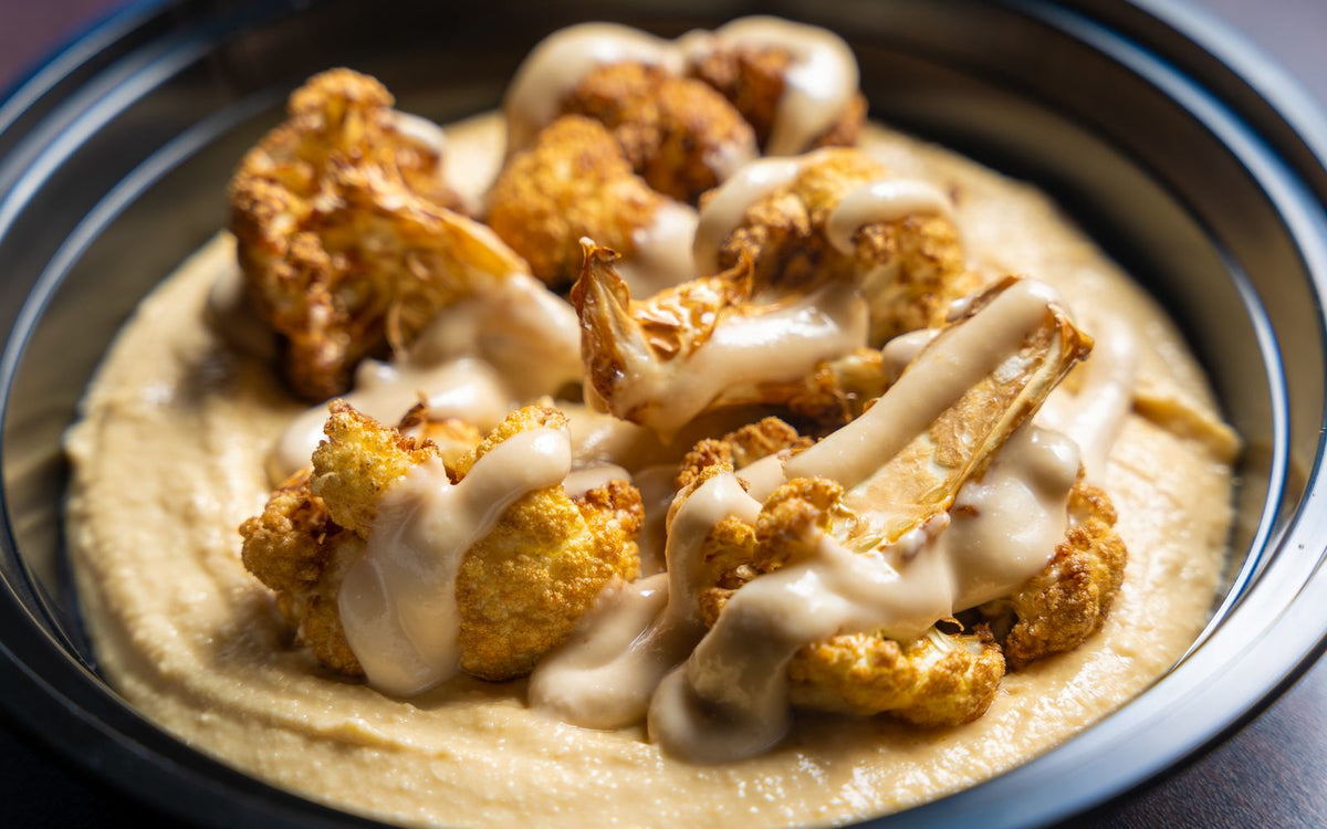 Roasted cauliflower florets on a sheet pan