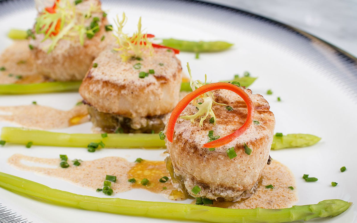 Seared scallops in a pan with browned butter