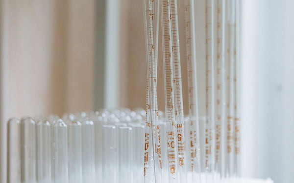 A collection of clean glass test tubes arranged in a laboratory setting