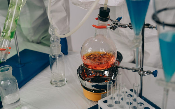 Close-up of a chemistry experiment setup with laboratory distillation equipment