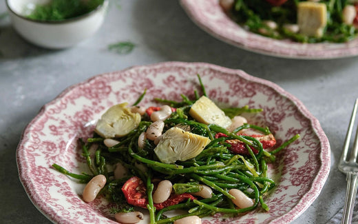 A plate of white bean and greens salad with lemon