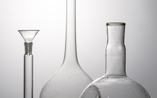 Elegant arrangement of laboratory glassware in a minimalistic studio setting
